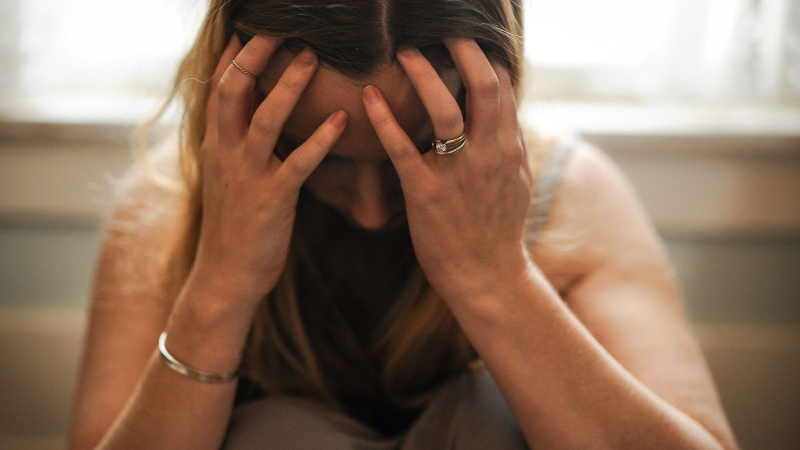 depressed stressed woman looking down