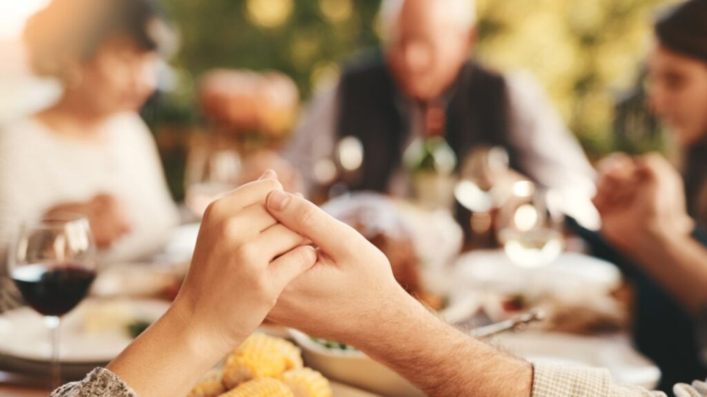 family, praying for eating and food for bonding, quality time for lunch and outdoor. Religious gesture, group and holding hands for brunch, family gathering