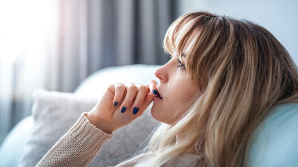 Woman at home deep in thoughts thinking and planning
