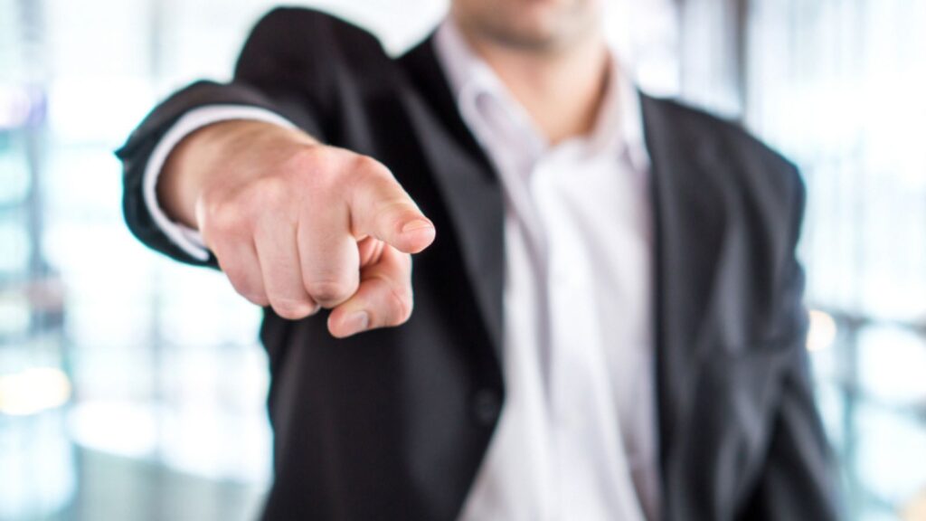 Boss giving order or firing employee. Powerful business man pointing camera with finger. Angry executive or manager. Tough leadership, strict