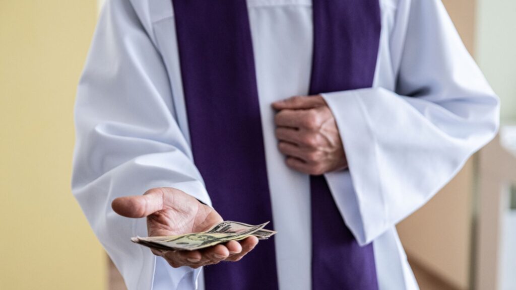 Catholic cleric priest counting American money dollar