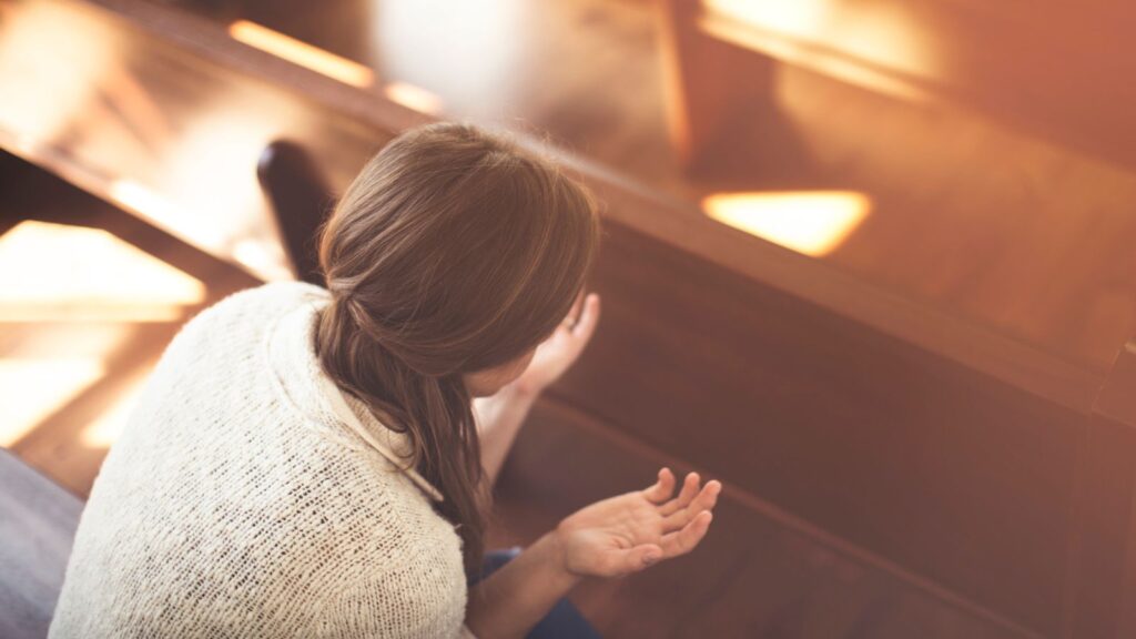 woman praying in church