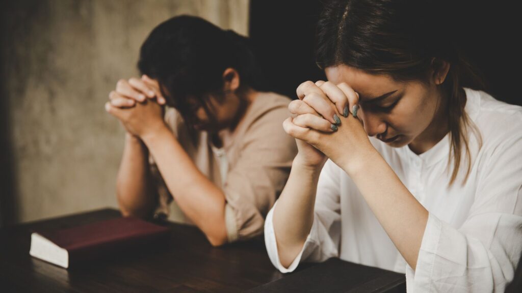 women praying to god ,friends